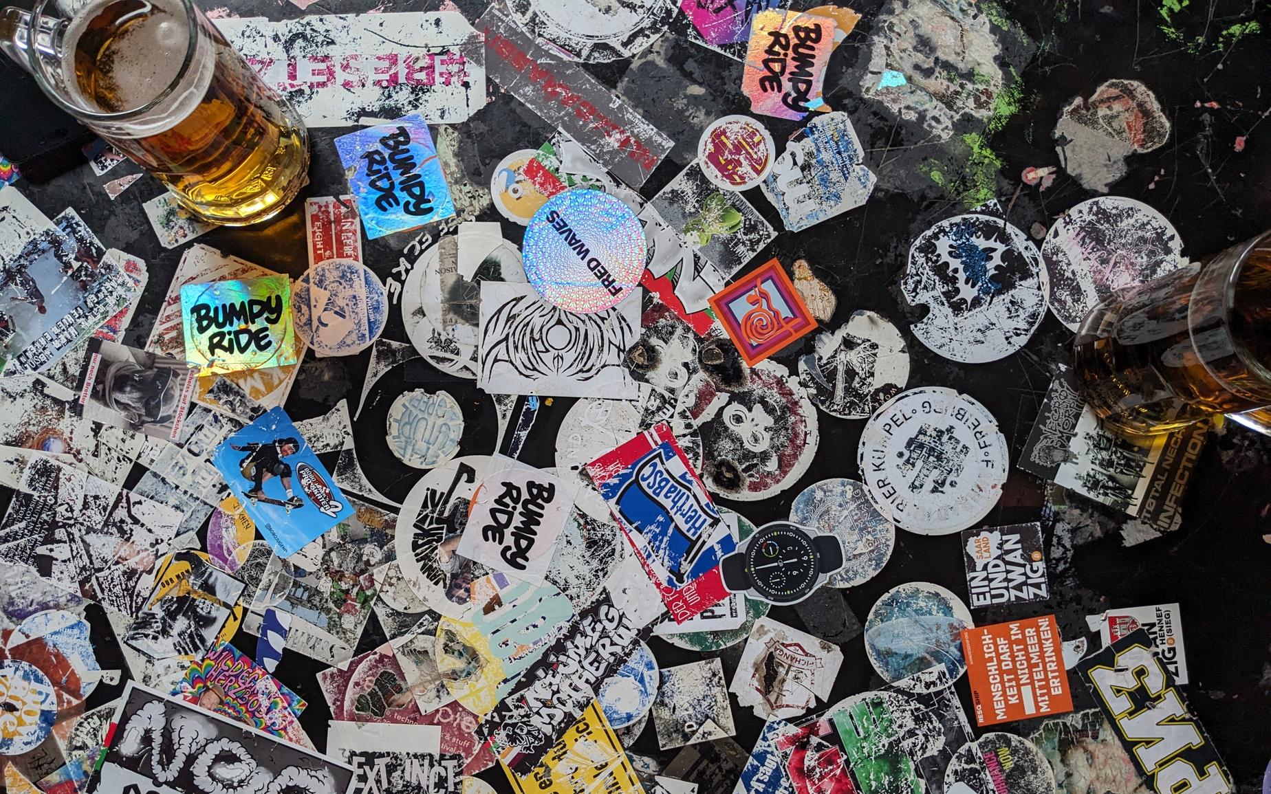 "Stickers on a Berlin pub table"