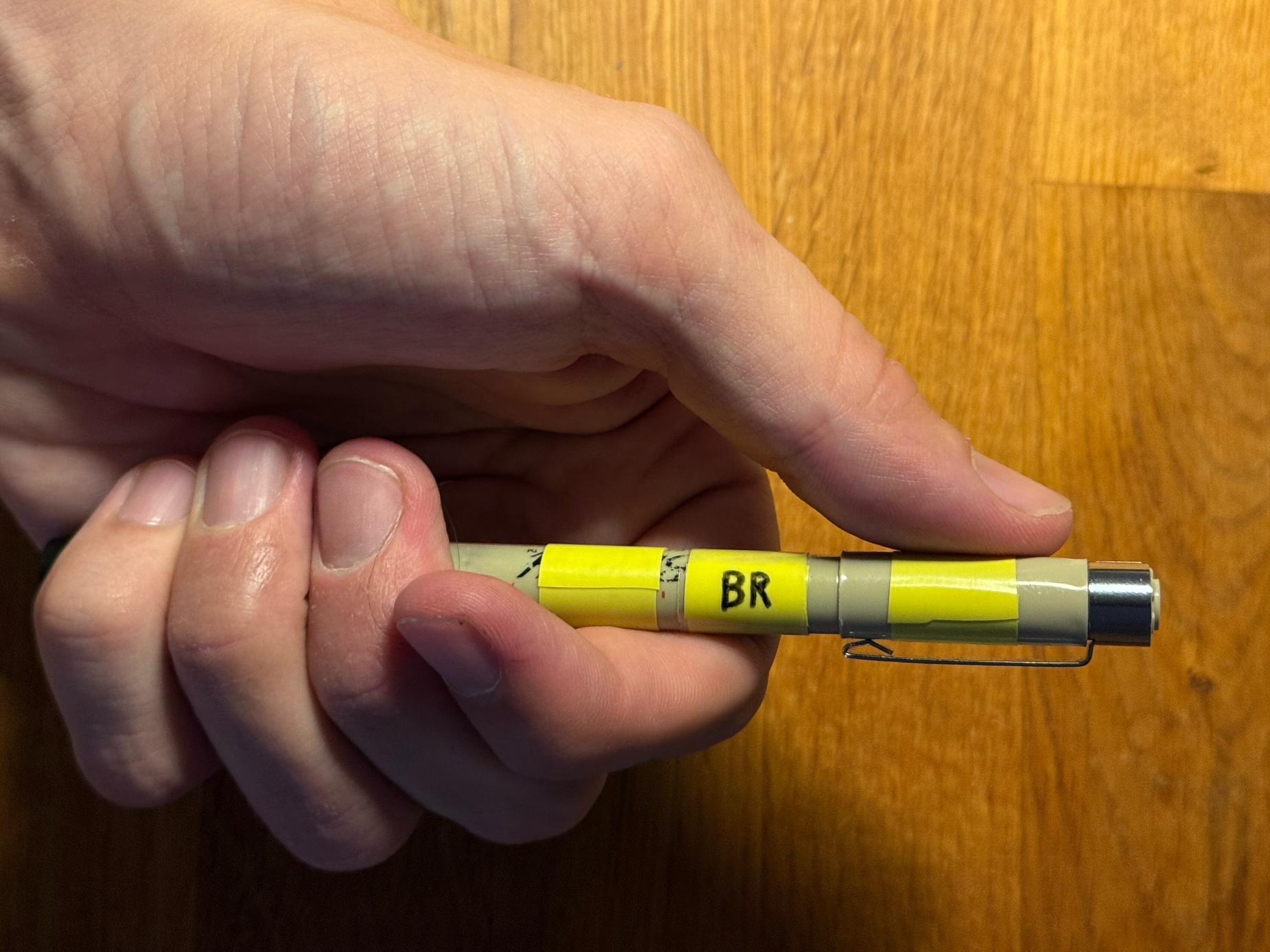 Pen marked with tape